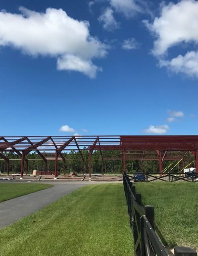 Red iron Metal Building Construction Florida